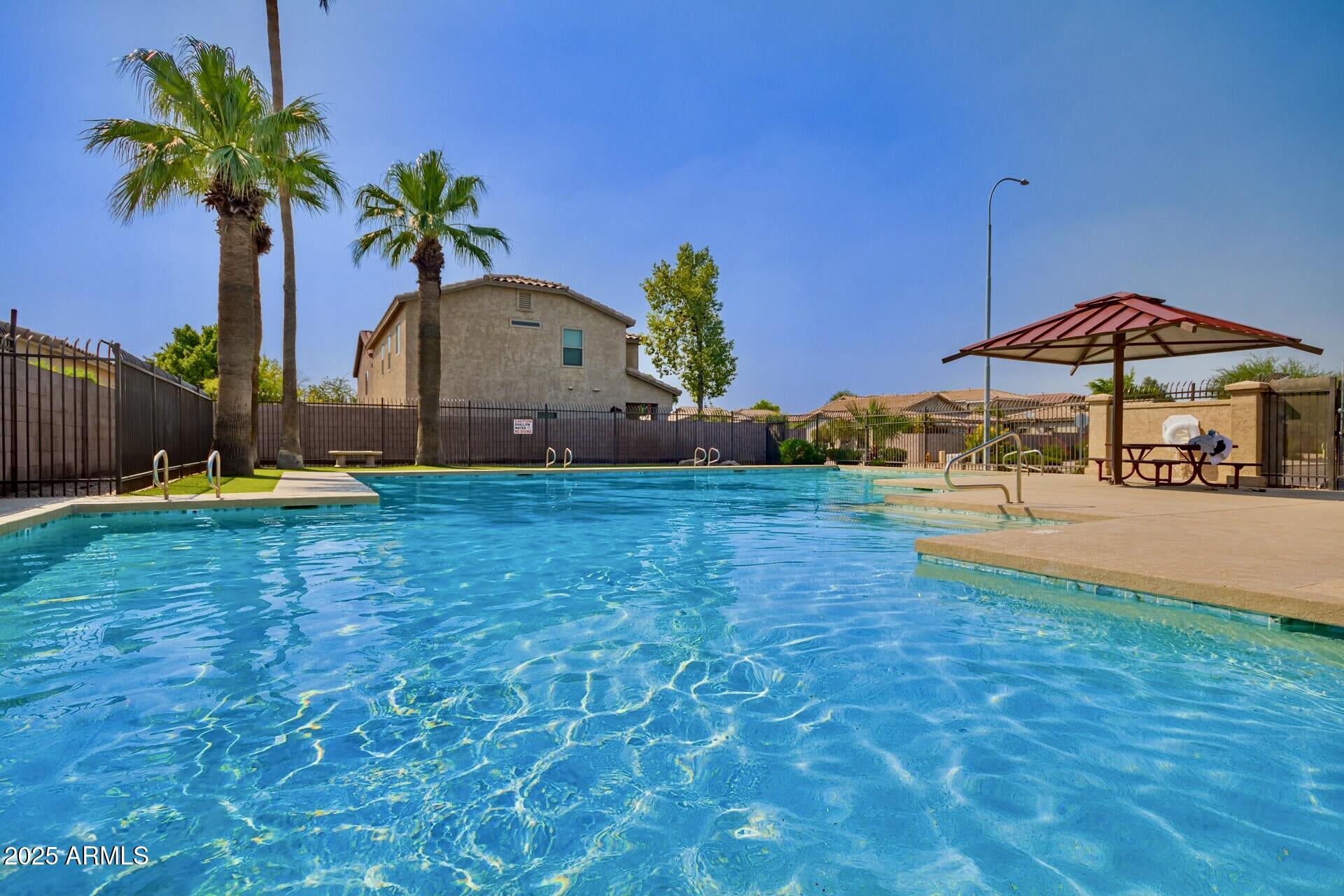 6456 South Nash Way Chandler, AZ 85249 - Photo 43 of 57 a swimming pool with outdoor seating