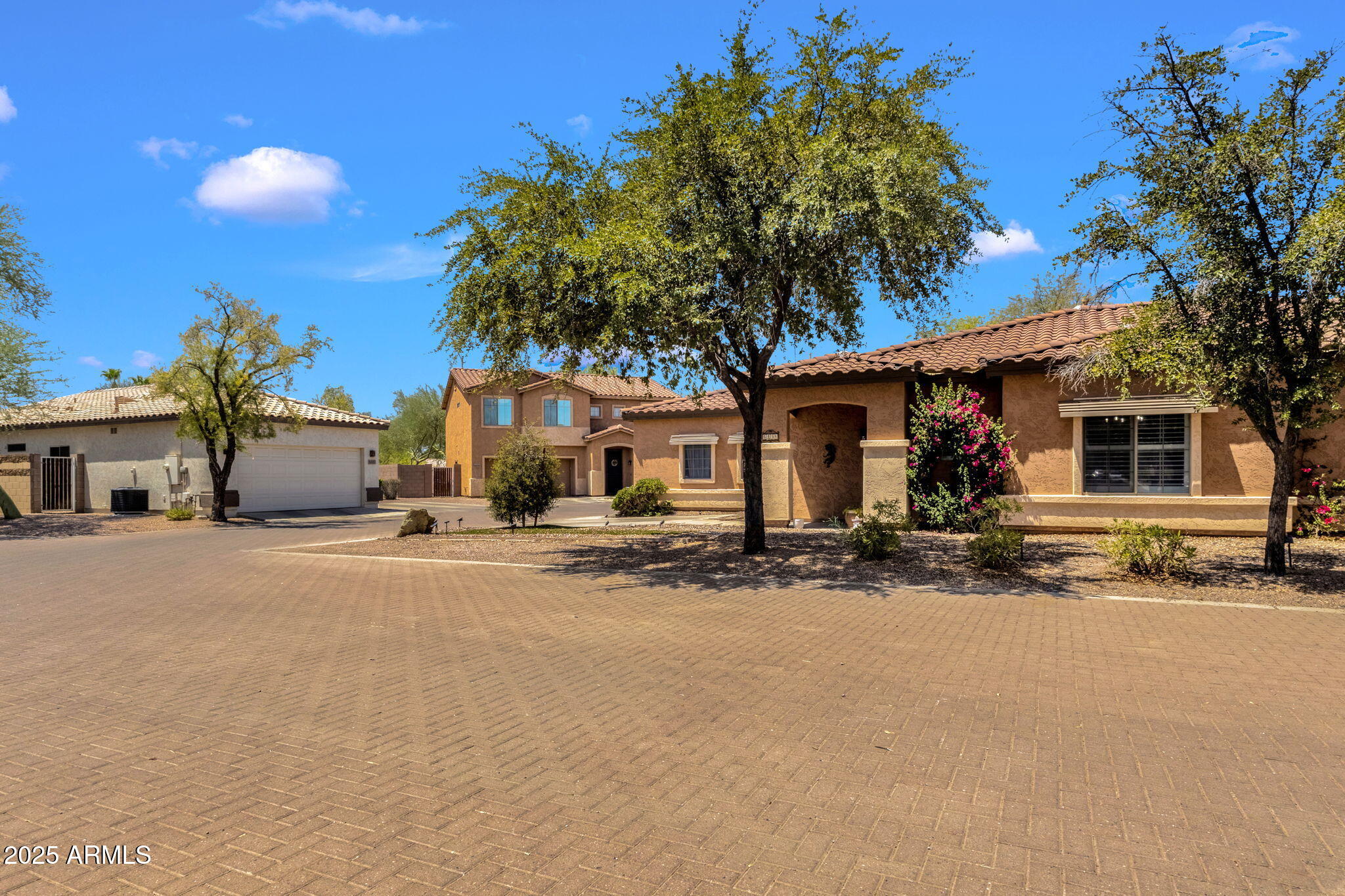 6456 South Nash Way Chandler, AZ 85249 - Photo 8 of 57 a front view of a house with a road and a yard