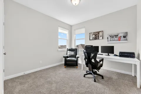 a bedroom with a bed and a table