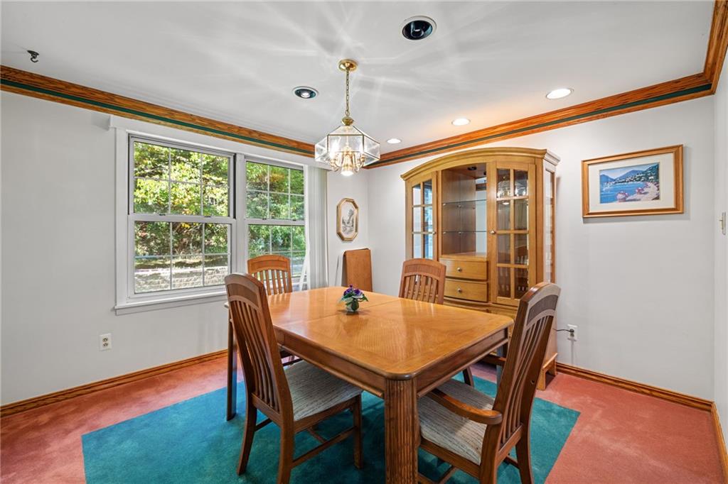 110 Atterbury Road Monroeville, PA 15146 - Photo 11 of 36 a dining room with furniture a chandelier and wooden floor