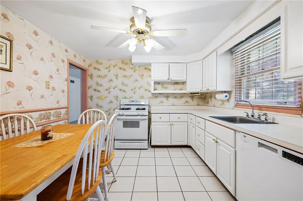 110 Atterbury Road Monroeville, PA 15146 - Photo 14 of 36 a kitchen with stainless steel appliances granite countertop a sink a stove cabinets counter space and a window
