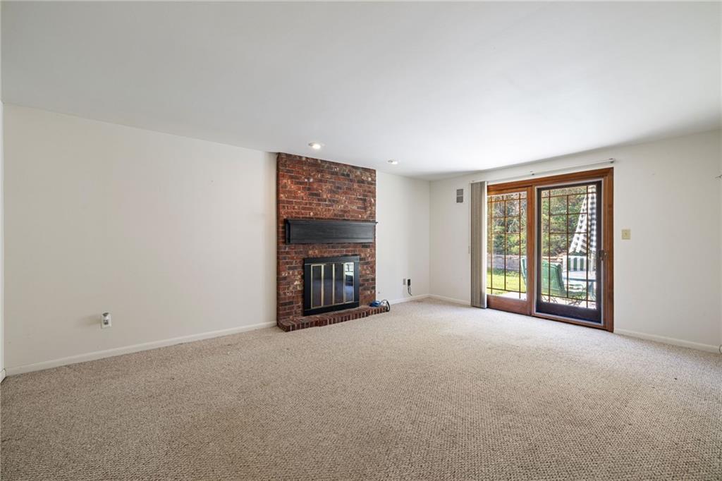 110 Atterbury Road Monroeville, PA 15146 - Photo 17 of 36 a view of an empty room with a fireplace