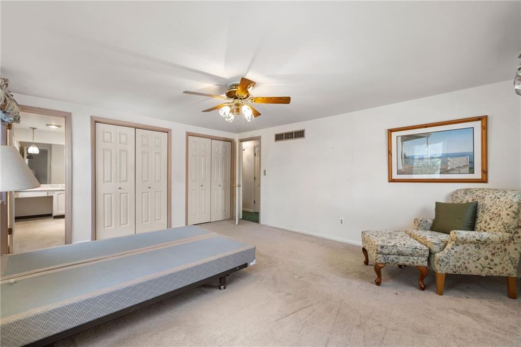 110 Atterbury Road Monroeville, PA 15146 - Photo 30 of 36 a bedroom with furniture and a chandelier