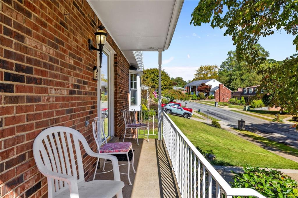 110 Atterbury Road Monroeville, PA 15146 - Photo 4 of 36 a balcony with table and chairs