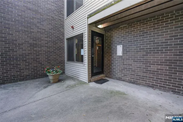 a view of an outdoor space with wooden fence