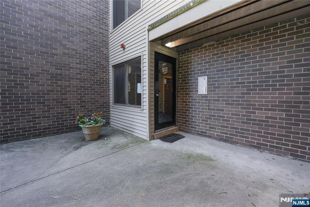 1 River, Unit 3G Nutley, NJ 07110 - Photo 20 of 25 a view of an outdoor space with wooden fence