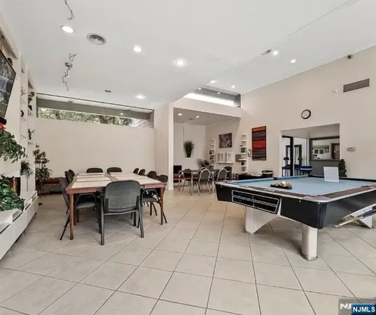 a swimming pool with outdoor seating and yard