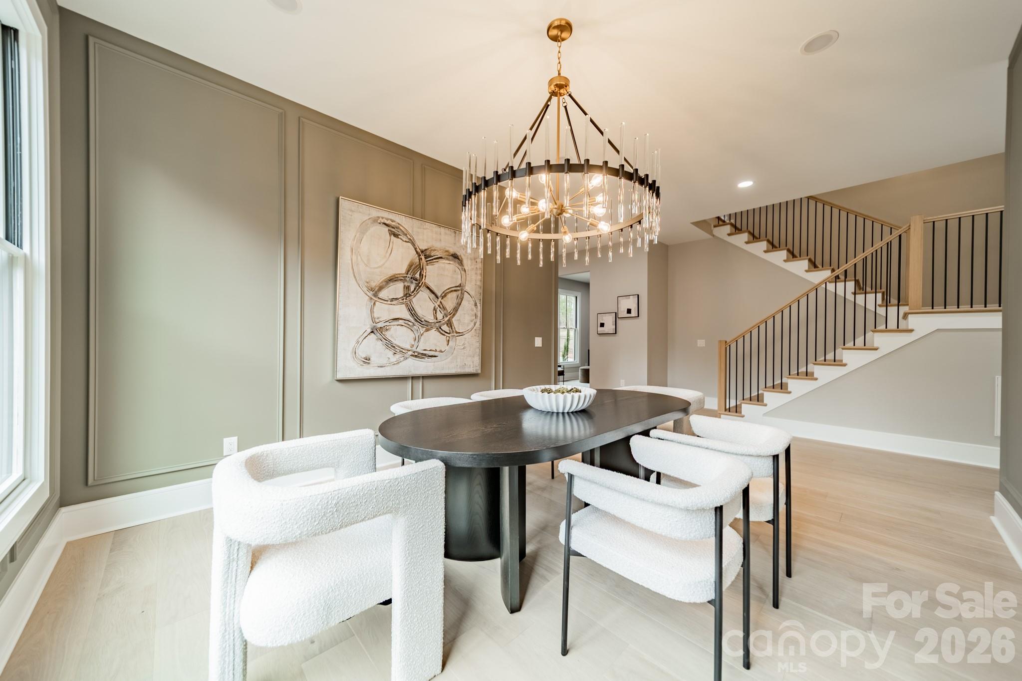 6805 Weddington Matthews Road Weddington, NC 28104 - Photo 13 of 38 a view of a dining room with furniture and chandelier