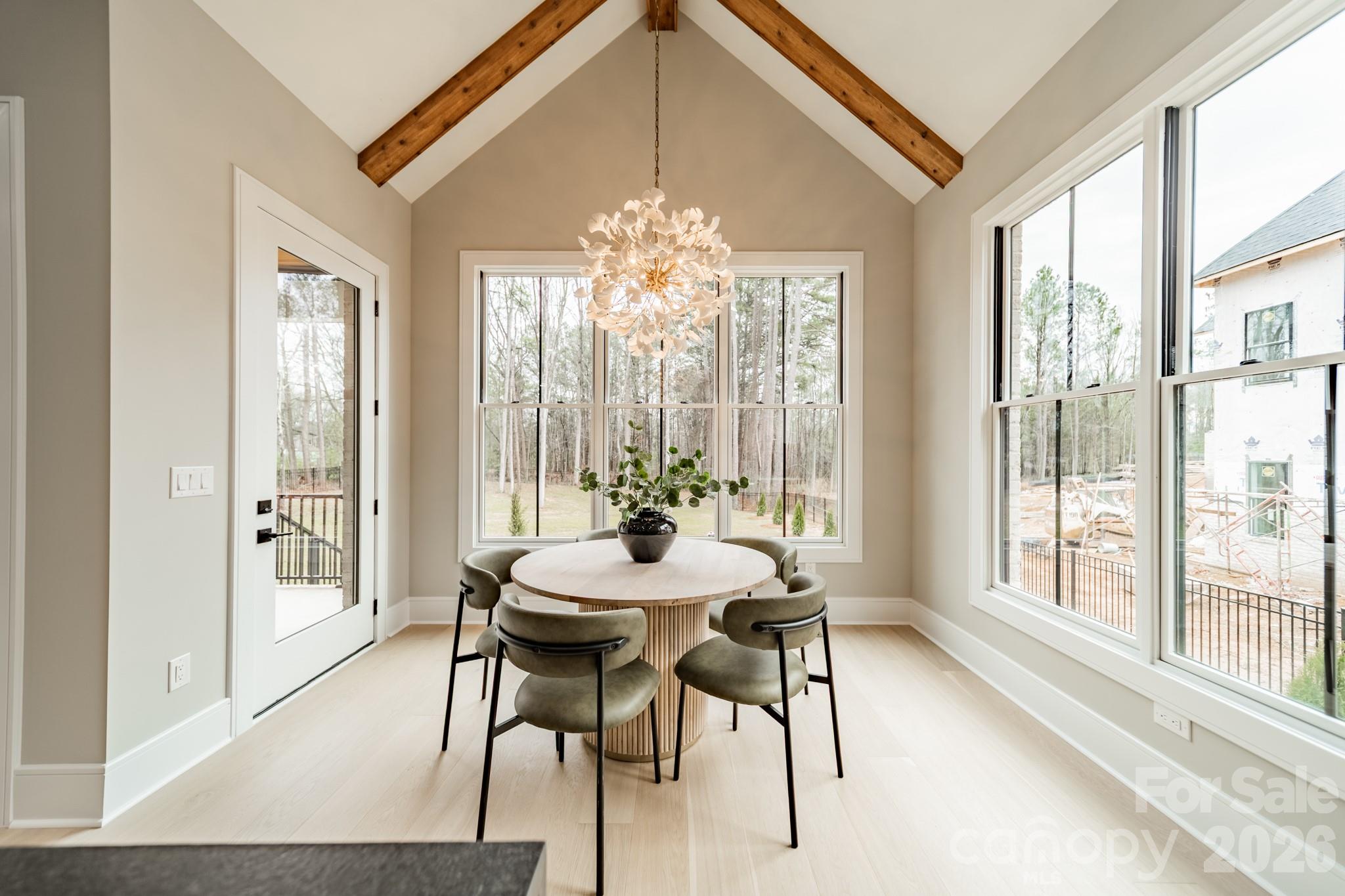 6805 Weddington Matthews Road Weddington, NC 28104 - Photo 16 of 38 a view of a dining room with furniture window and outside view