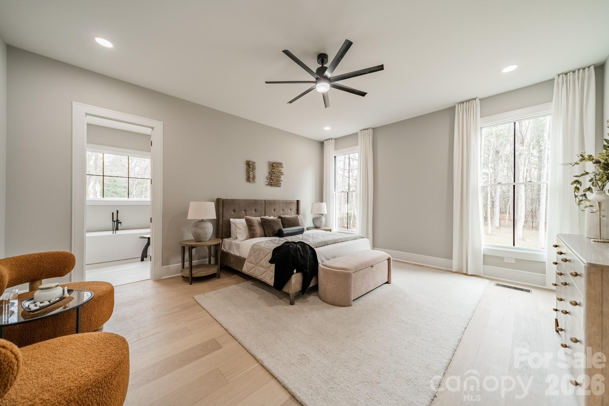 6805 Weddington Matthews Road Weddington, NC 28104 - Photo 20 of 38 a bedroom with a bed couch and window