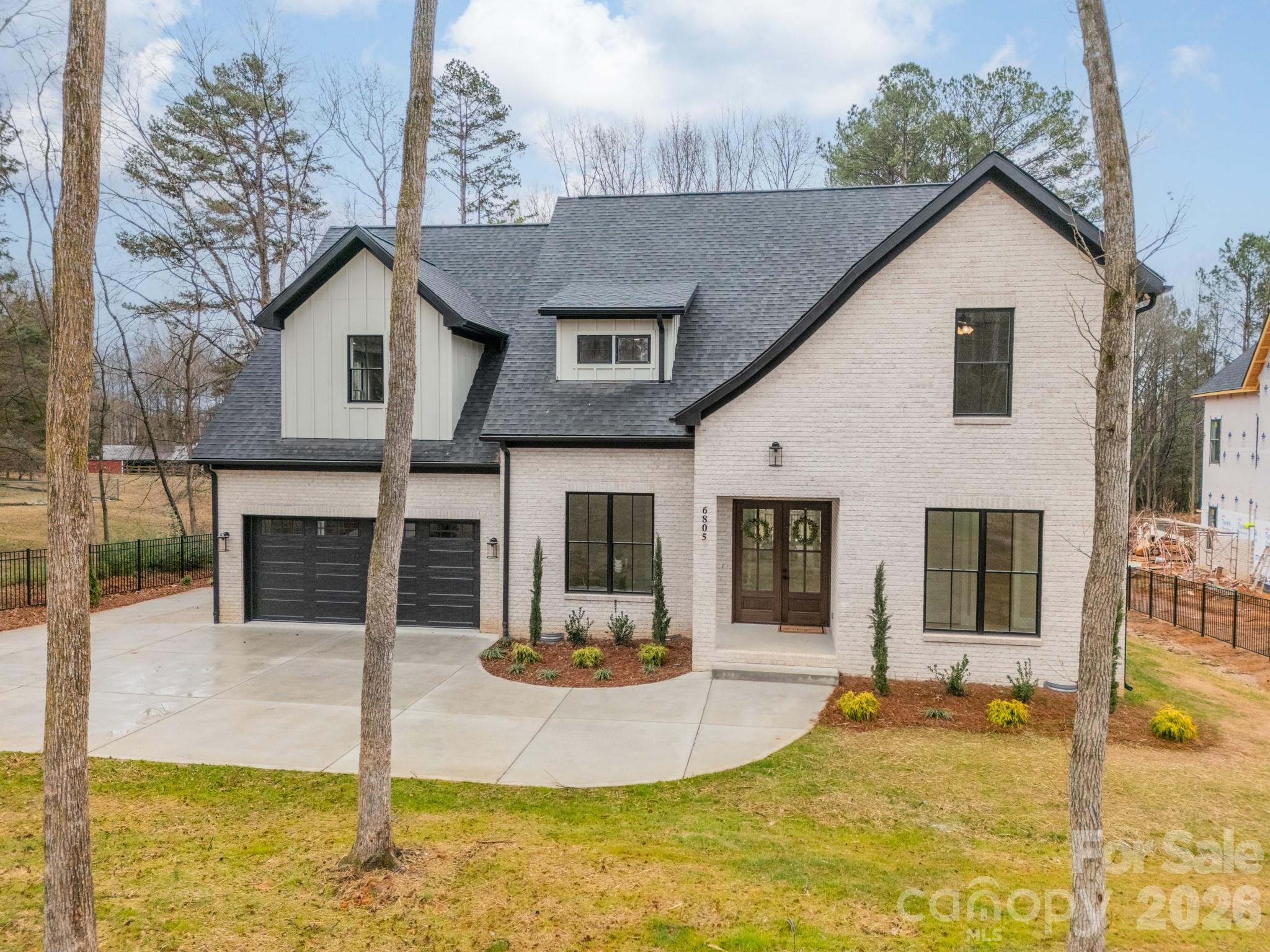 6805 Weddington Matthews Road Weddington, NC 28104 - Photo 2 of 38 a view of a house with yard and sitting area