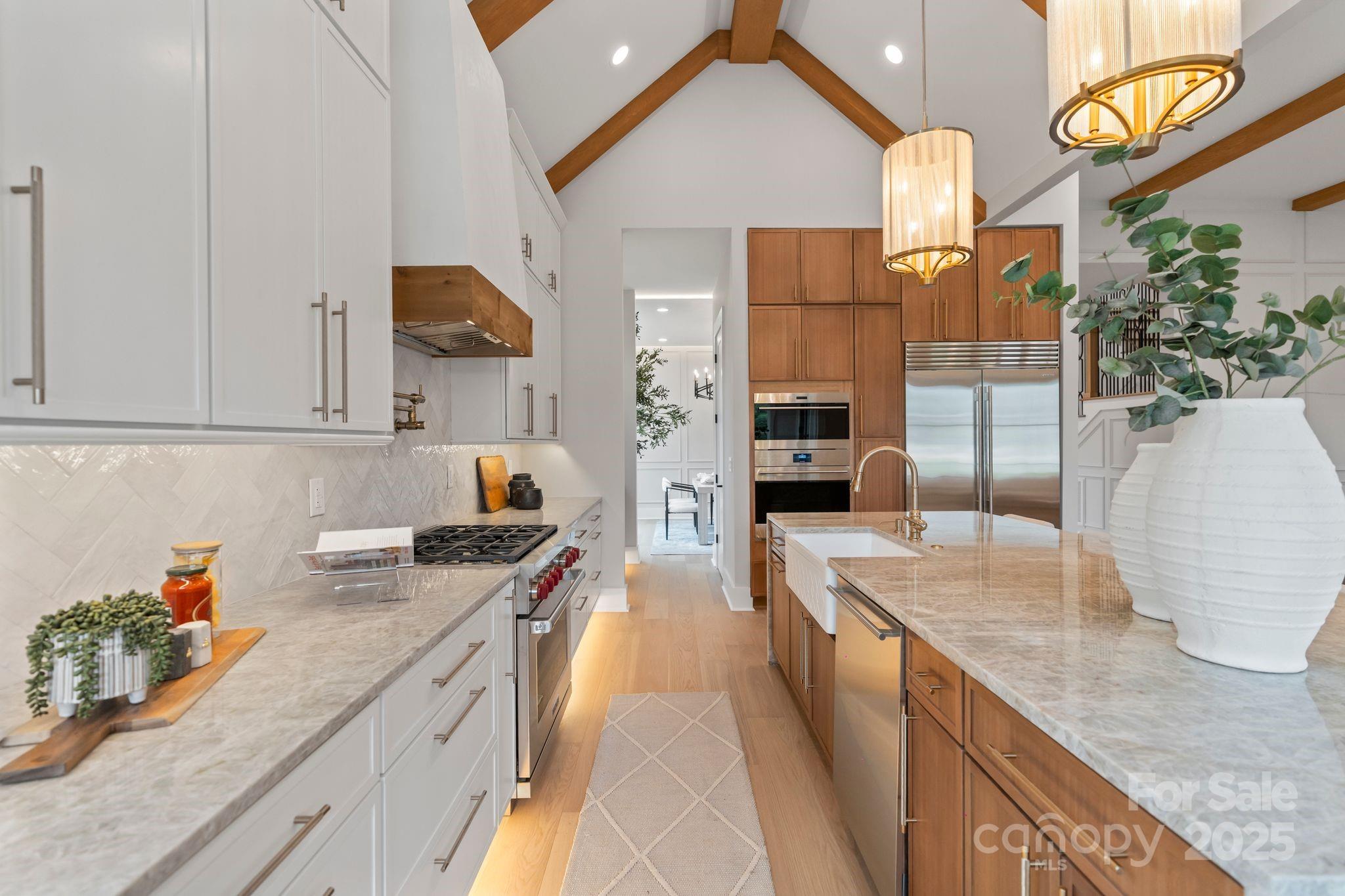 6805 Weddington Matthews Road Weddington, NC 28104 - Photo 2 of 23 a kitchen with stainless steel appliances granite countertop a sink and cabinets