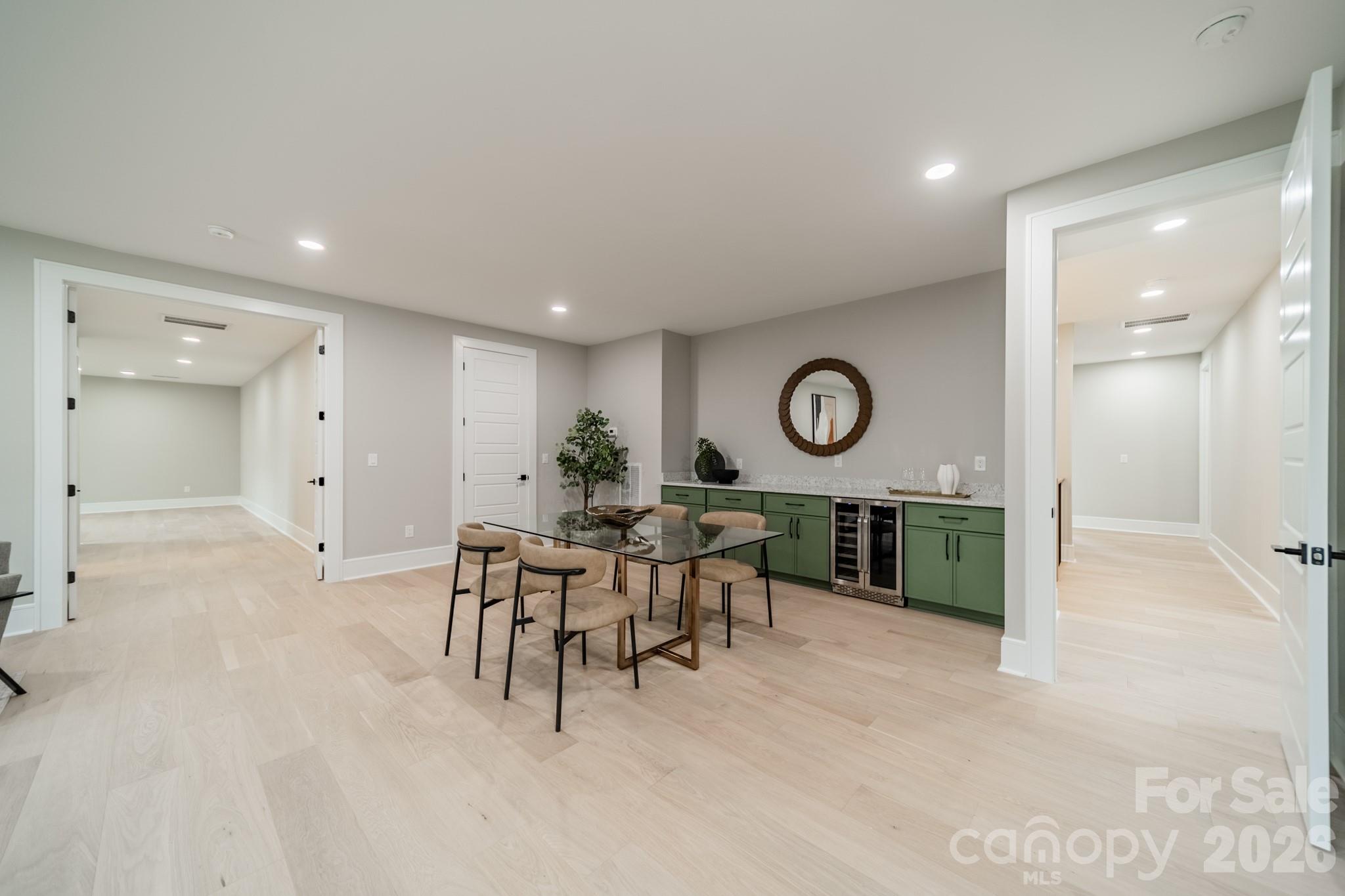 6805 Weddington Matthews Road Weddington, NC 28104 - Photo 29 of 38 an open kitchen with table and chairs