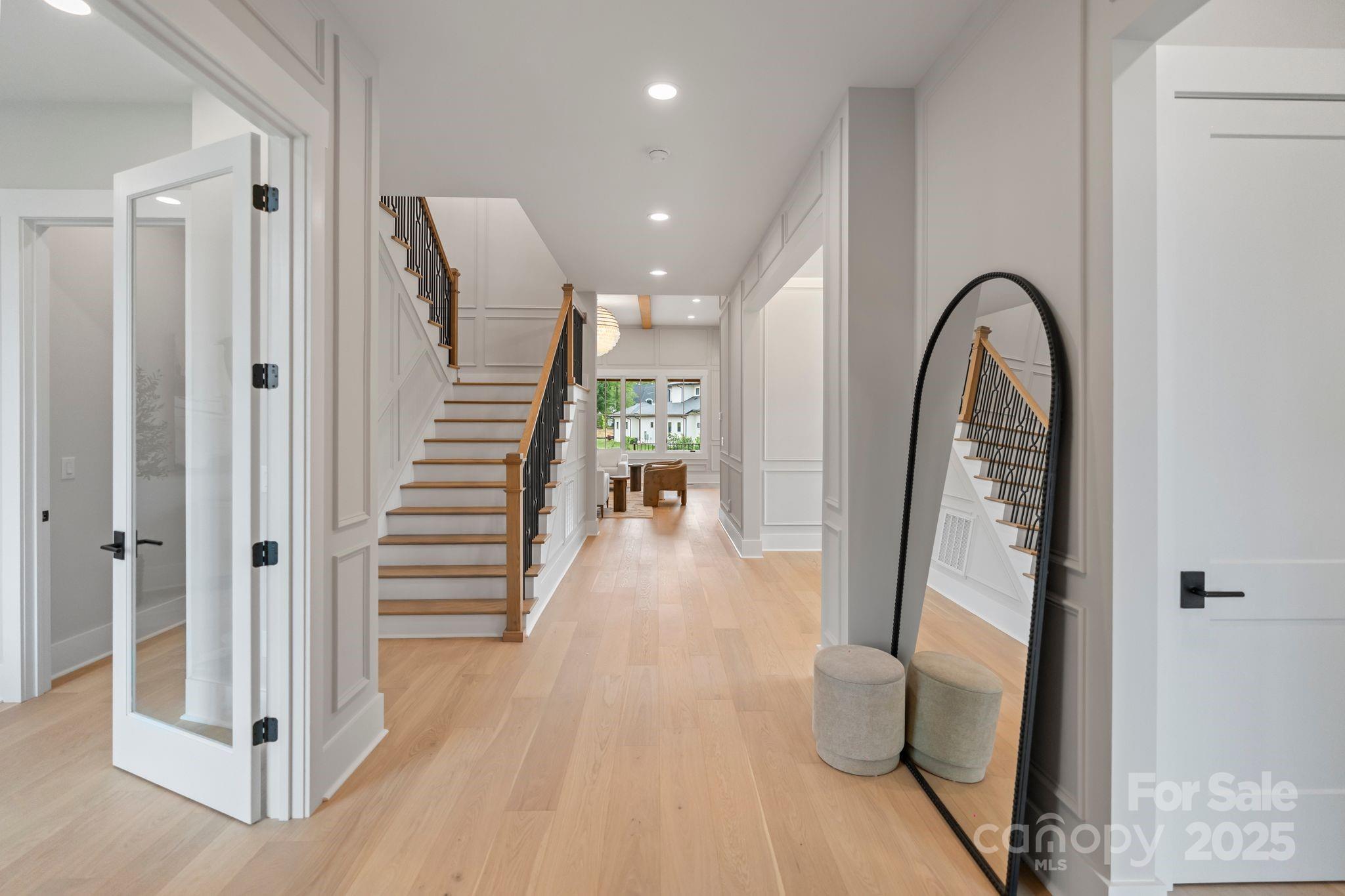6805 Weddington Matthews Road Weddington, NC 28104 - Photo 3 of 23 a view of a hallway view with wooden floor and staircase