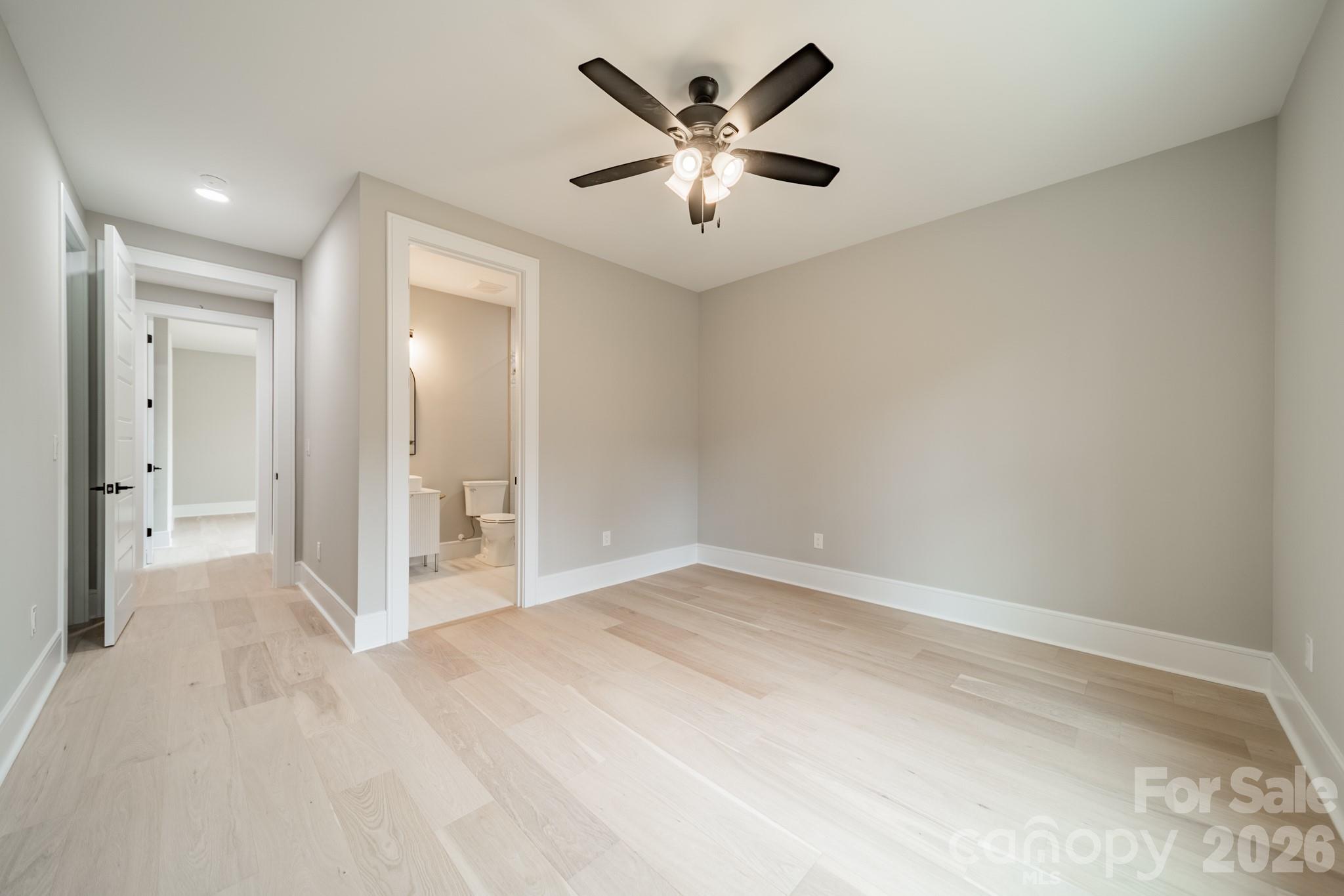 6805 Weddington Matthews Road Weddington, NC 28104 - Photo 36 of 38 a view of a livingroom with a ceiling fan