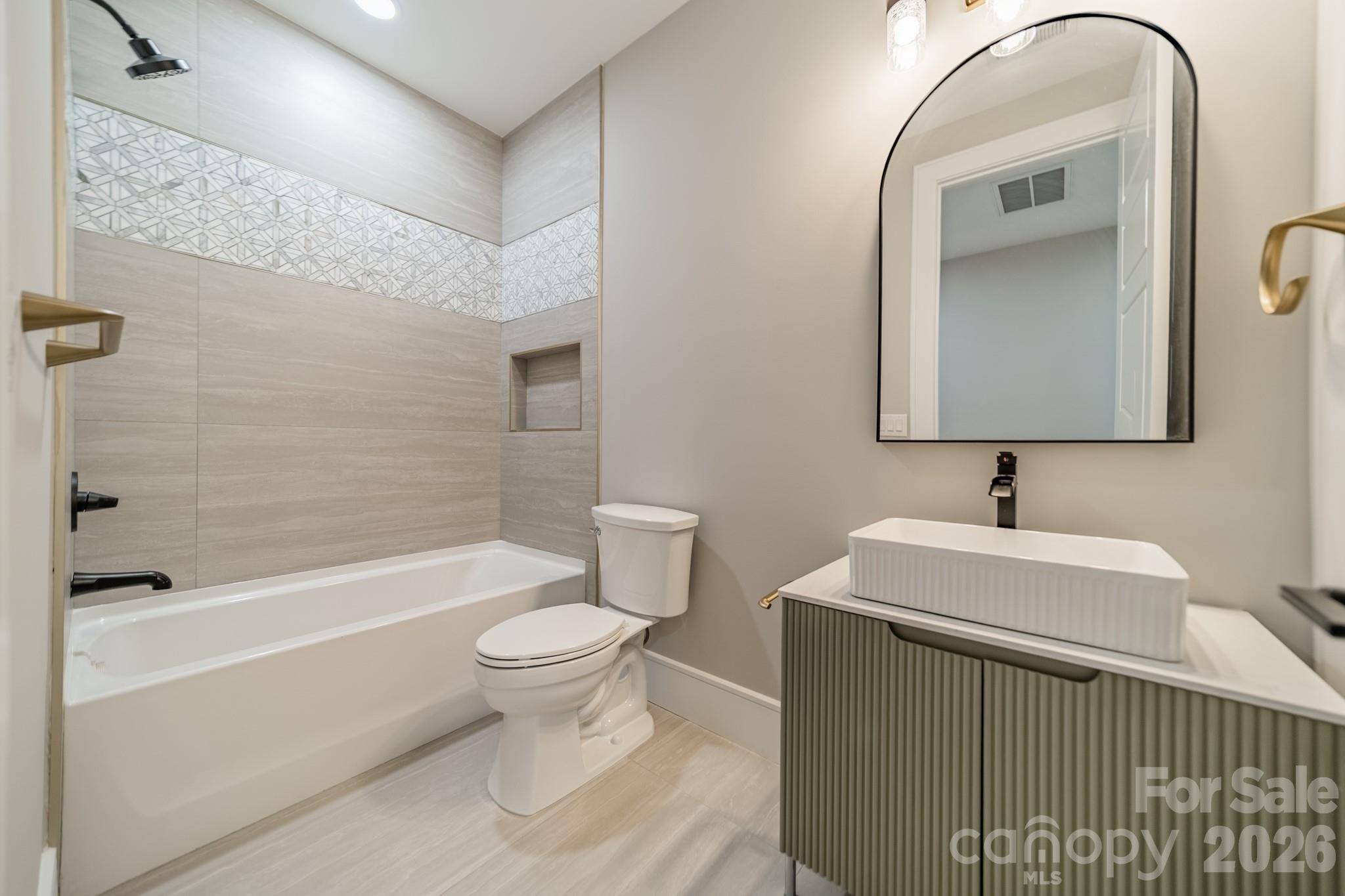 6805 Weddington Matthews Road Weddington, NC 28104 - Photo 38 of 38 a bathroom with a sink a toilet and shower