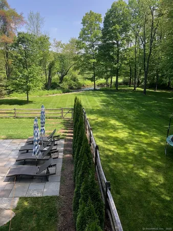 a view of a backyard with sitting area