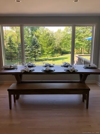 a view of a patio with a table chairs and a table