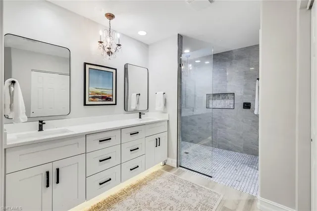 a bedroom with a bed and painting on the wall