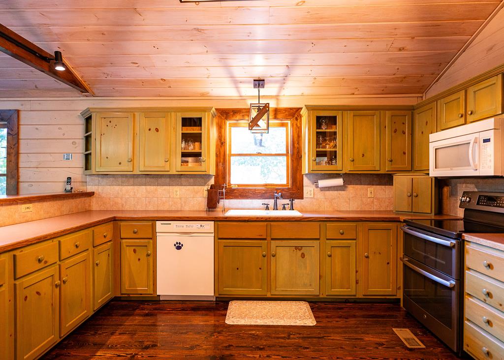 192 Fingerboard Road Reliance, TN 37369 - Photo 13 of 57 a kitchen with sink cabinets and wooden floor