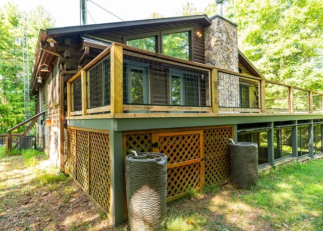 a view of a house with a yard and sitting area