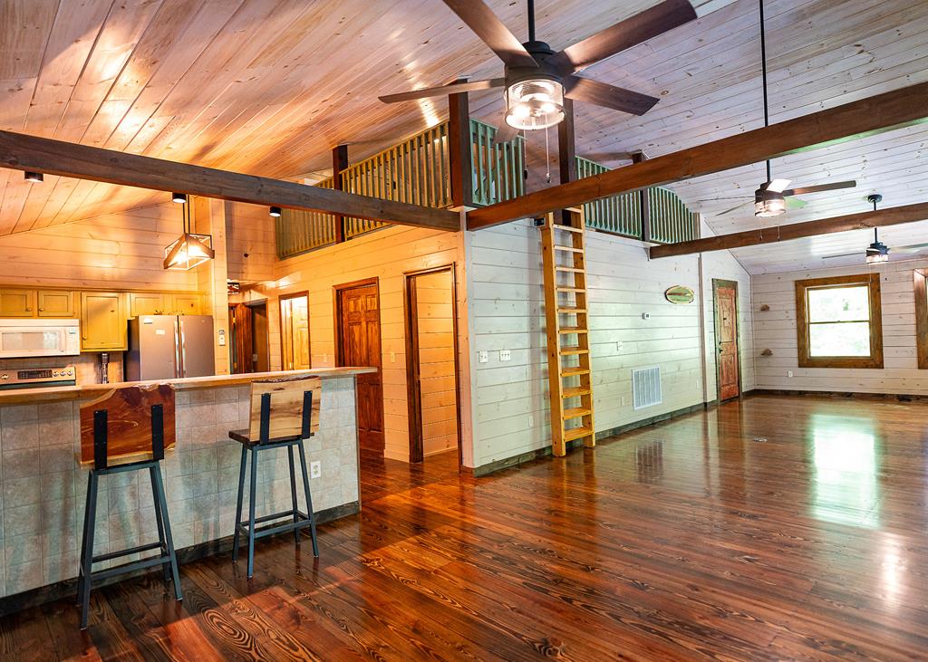 192 Fingerboard Road Reliance, TN 37369 - Photo 4 of 57 a view of interior space with wooden floor and windows