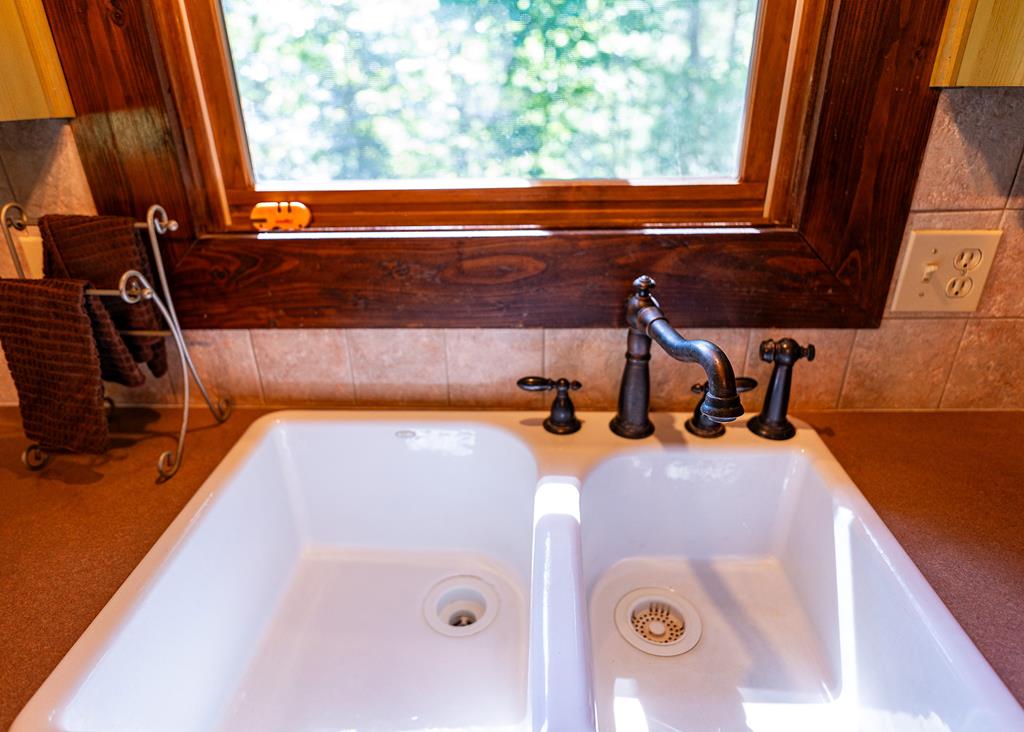 192 Fingerboard Road Reliance, TN 37369 - Photo 42 of 57 a bathroom with a granite countertop sink and a mirror