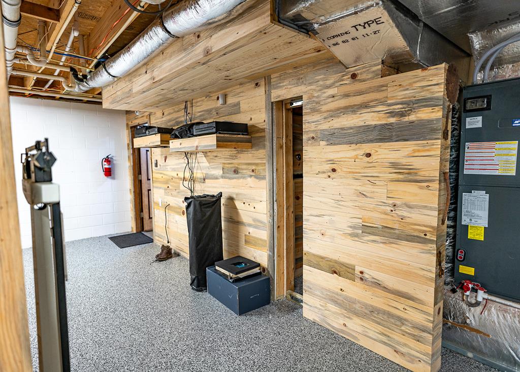 192 Fingerboard Road Reliance, TN 37369 - Photo 45 of 57 a view of walk in closet with clothes and shoes