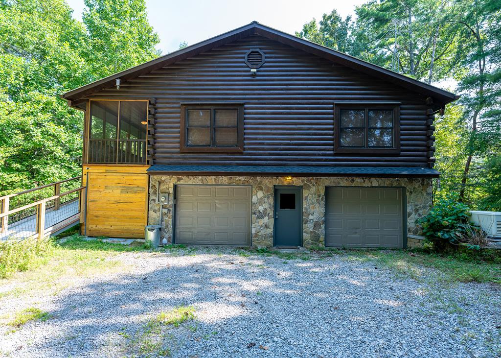 192 Fingerboard Road Reliance, TN 37369 - Photo 52 of 57 a front view of a house with a garden
