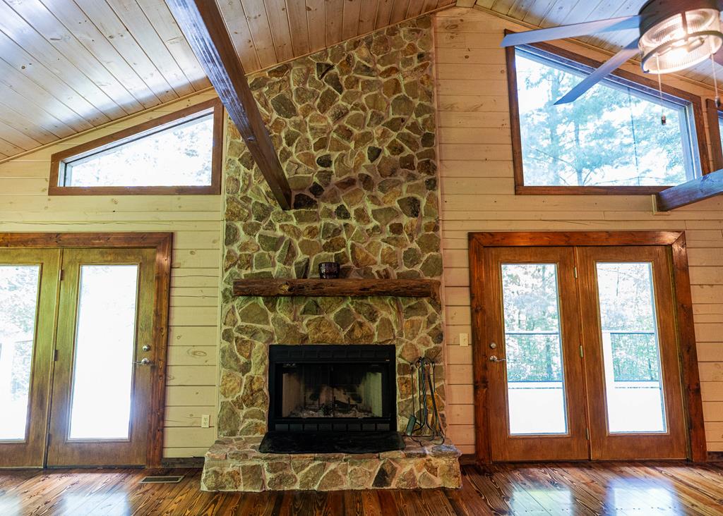 192 Fingerboard Road Reliance, TN 37369 - Photo 7 of 57 a living room with a fireplace and a large window