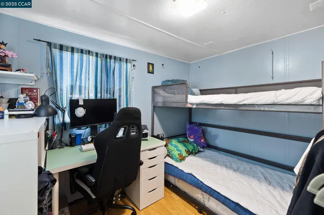 a work room with furniture and a potted plant
