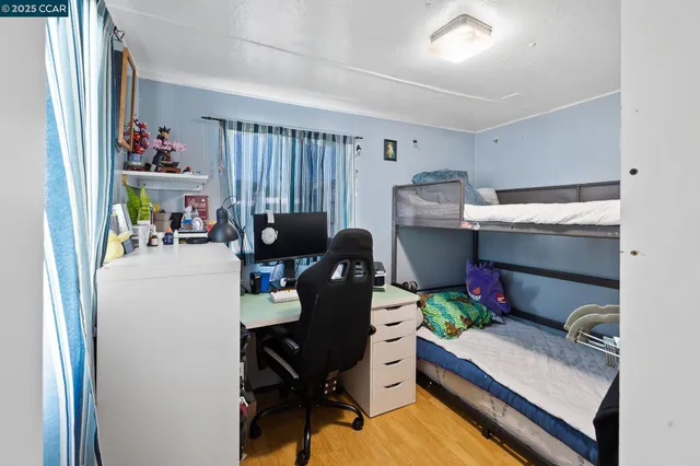 a work room with furniture and a window