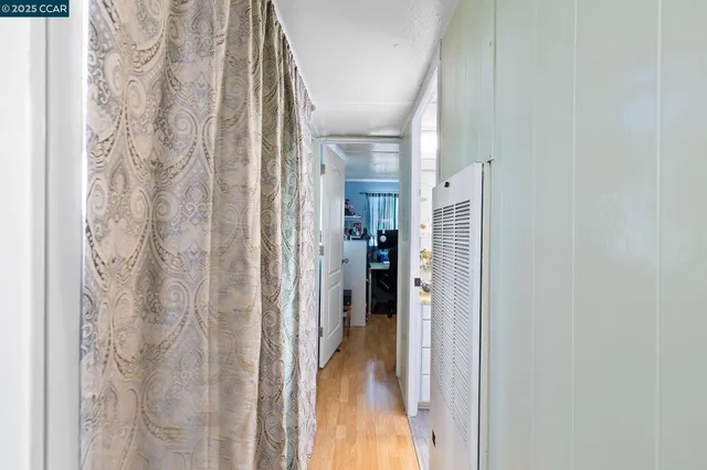 a view of a bathroom from a hallway