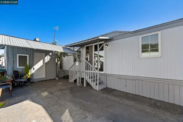 a view of a house with wooden stairs