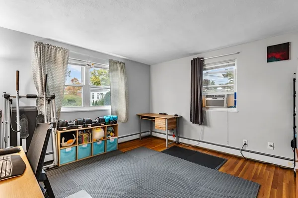 a bedroom with furniture and a window