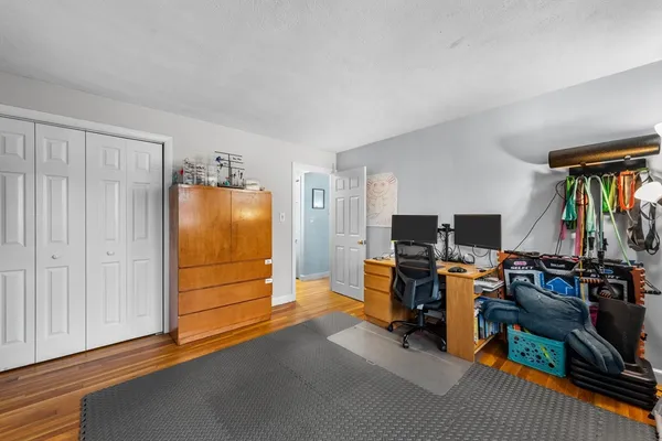 a view of a livingroom with furniture and a flat screen tv