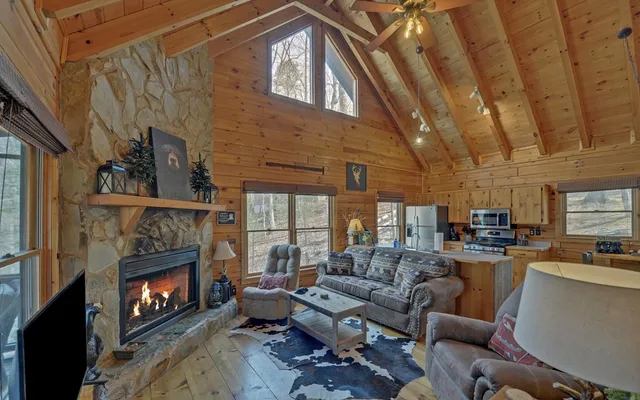 a bedroom with a bed a dresser next to a window
