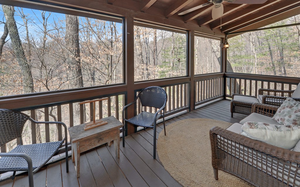 184 Smith Hill Road Blue Ridge, GA 30513 - Photo 17 of 36 a balcony with furniture and wooden floor