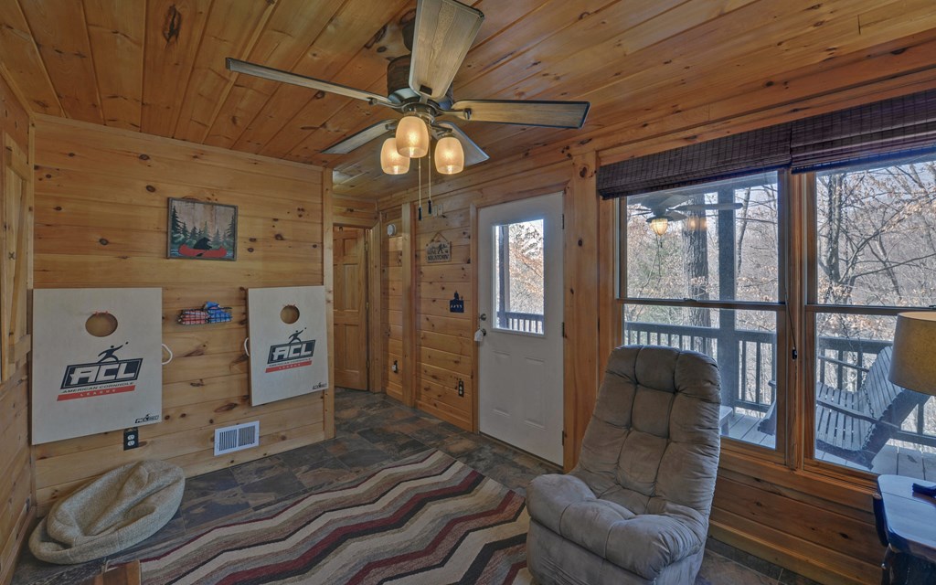 184 Smith Hill Road Blue Ridge, GA 30513 - Photo 26 of 36 a living room with furniture and a flat screen tv
