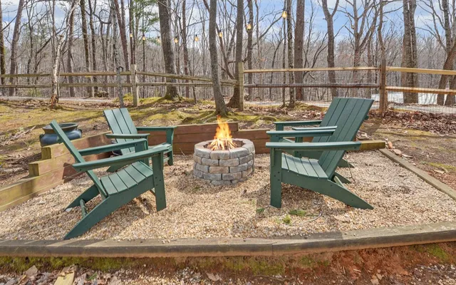a view of a swimming pool with an outdoor space and seating area