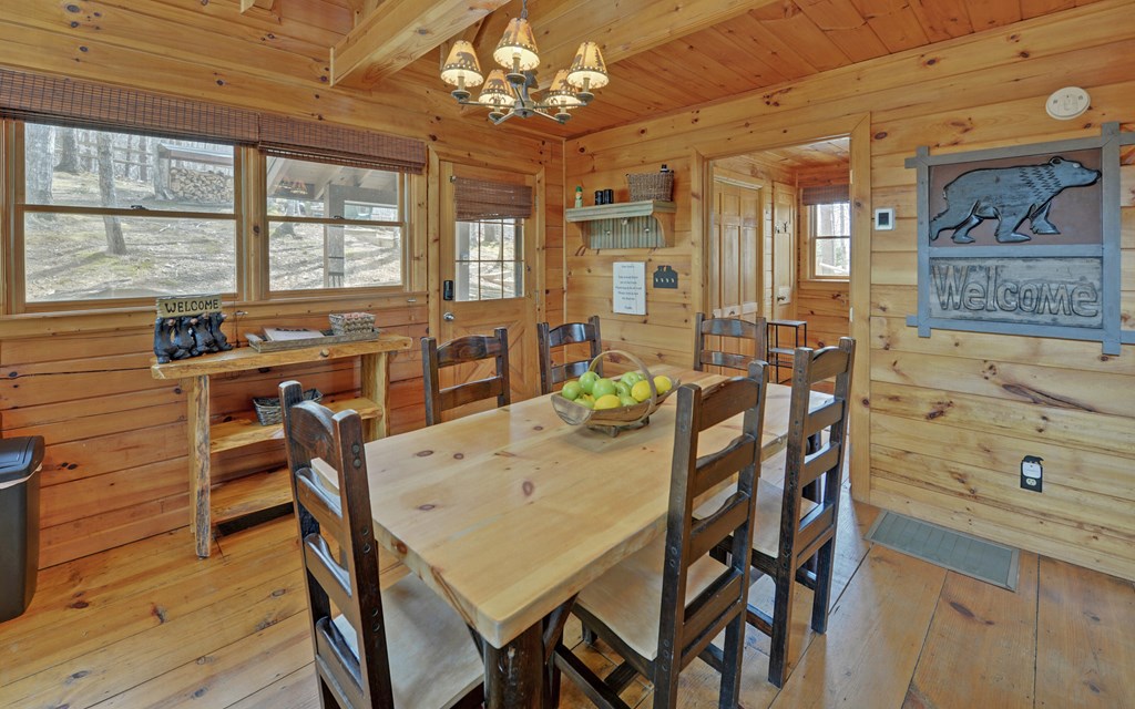 184 Smith Hill Road Blue Ridge, GA 30513 - Photo 6 of 36 a view of a dining room with furniture window and wooden floor