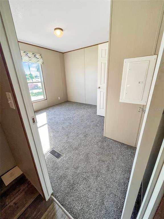 6027 Quince Street Punta Gorda, FL 33950 - Photo 11 of 18 a view of room with window and hallway