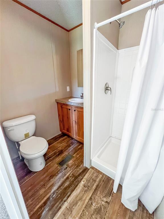 6027 Quince Street Punta Gorda, FL 33950 - Photo 13 of 18 a bathroom with a toilet and a shower