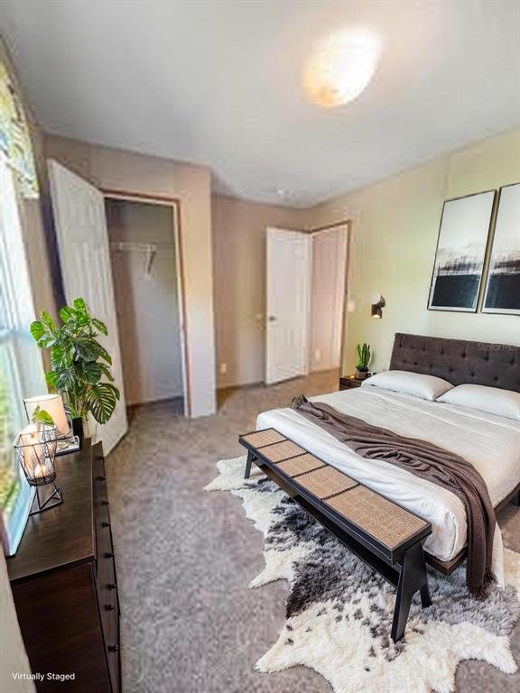 6027 Quince Street Punta Gorda, FL 33950 - Photo 17 of 18 a bedroom with a bed and a potted plant