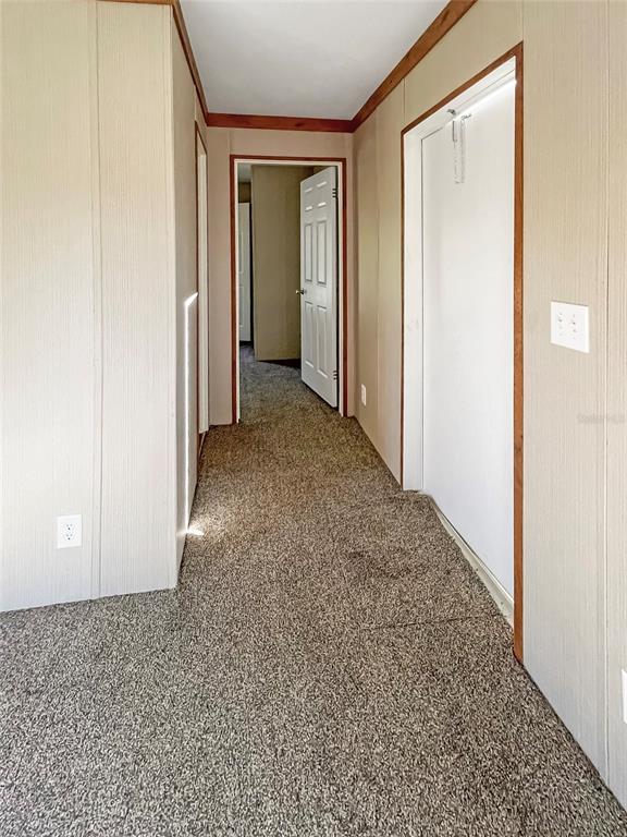 6027 Quince Street Punta Gorda, FL 33950 - Photo 5 of 18 a view of a room with a hallway