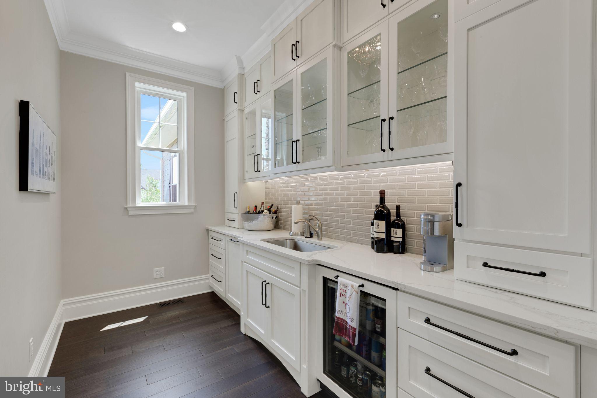 15 Marquis Ridge Holland, PA 18966 - Photo 12 of 83 a kitchen with stainless steel appliances white cabinets and a window