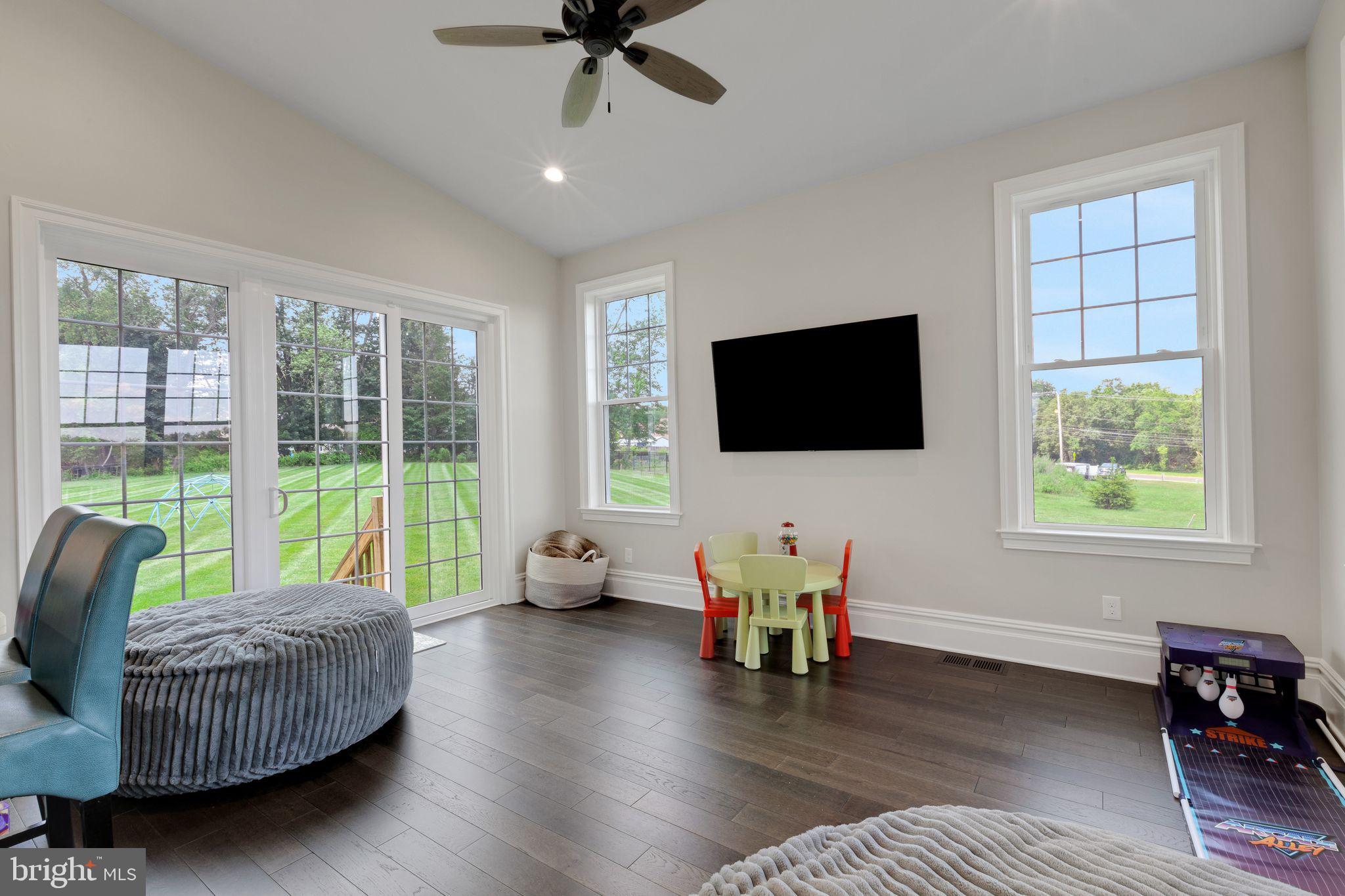 15 Marquis Ridge Holland, PA 18966 - Photo 33 of 83 a living room with furniture and a flat screen tv