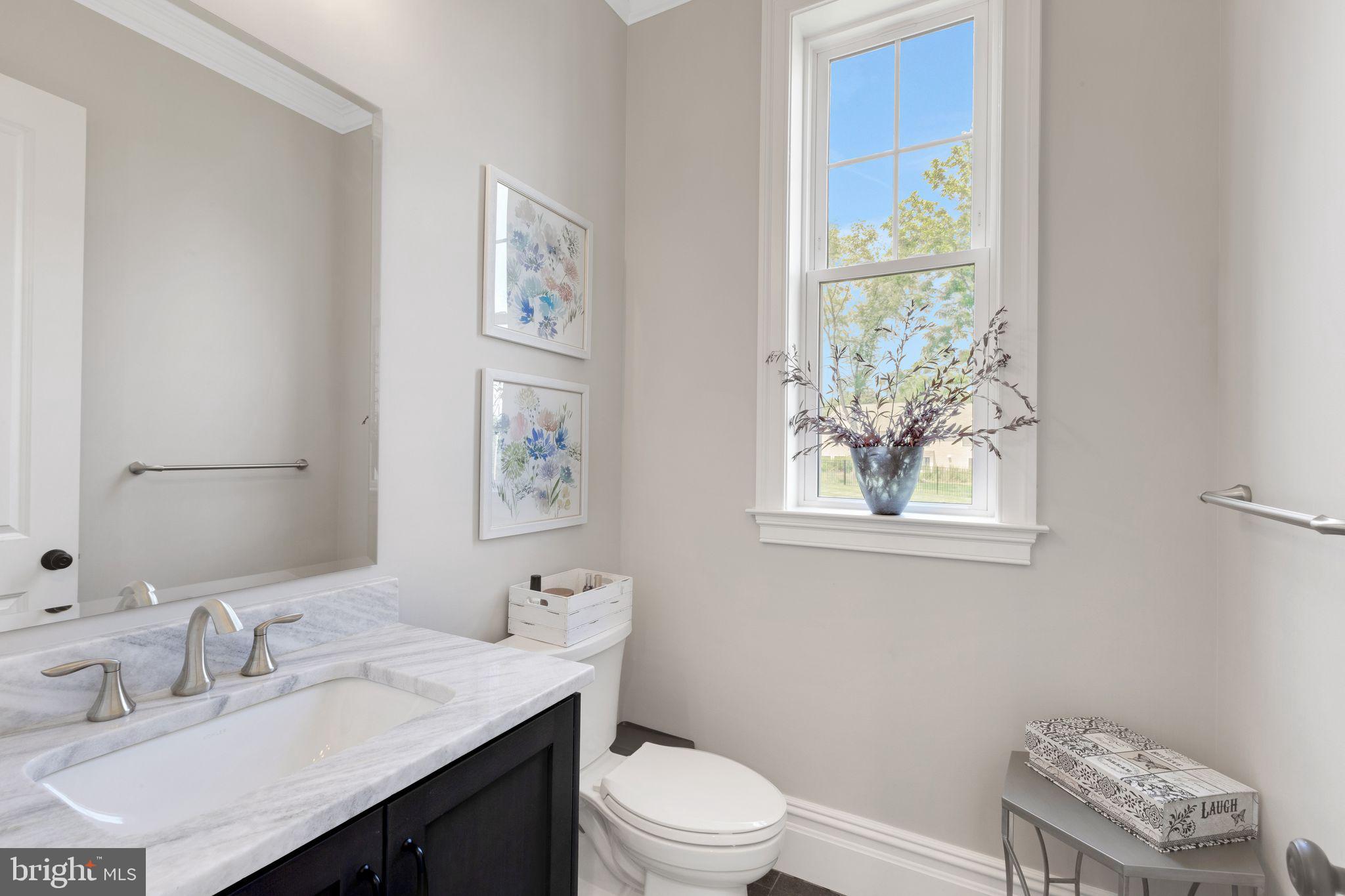 15 Marquis Ridge Holland, PA 18966 - Photo 35 of 83 a bathroom with a toilet a sink a window and a mirror