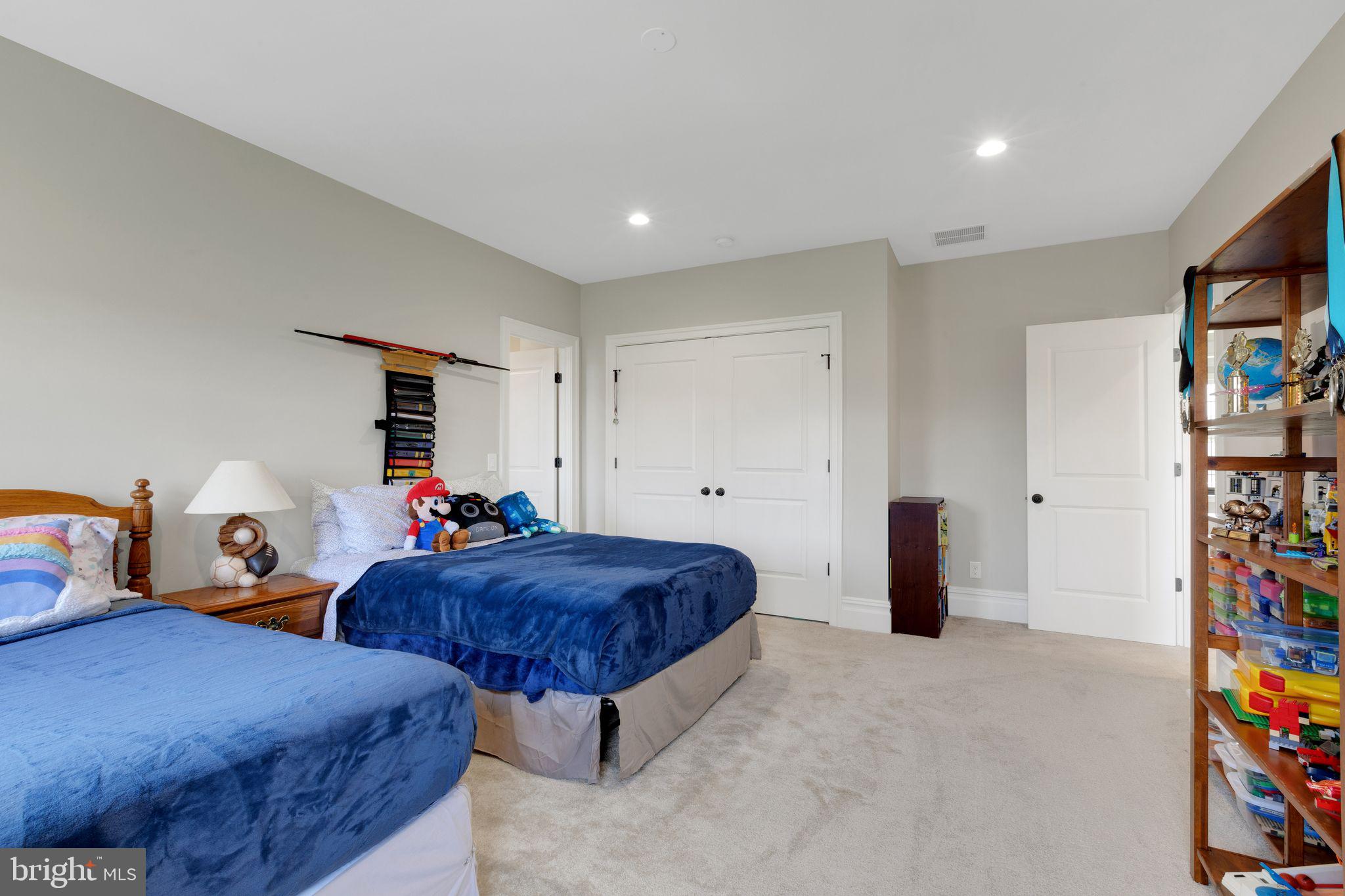 15 Marquis Ridge Holland, PA 18966 - Photo 57 of 83 a spacious bedroom with two beds and a plant