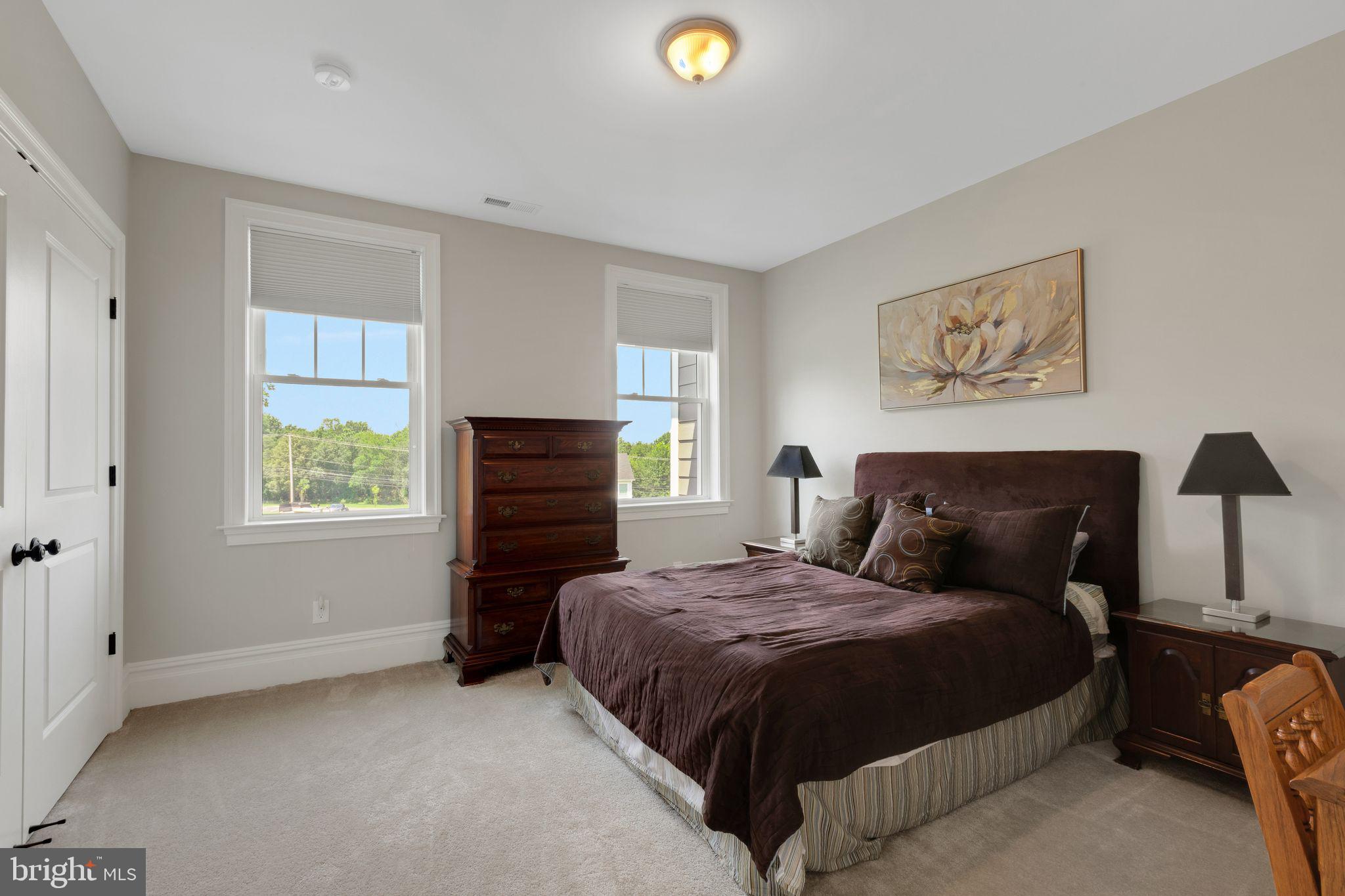 15 Marquis Ridge Holland, PA 18966 - Photo 60 of 83 a bedroom with a bed and a window